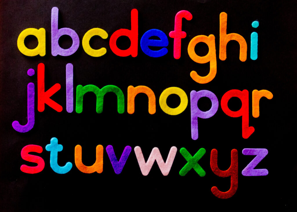 Felt letters, A to Z, on black background.